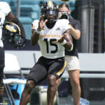 
              Southern Miss wide receiver Jakarius Caston catches a pass during the second half of an NCAA college football game against Miami, Saturday, Sept. 10, 2022, in Miami Gardens, Fla. (AP Photo/Wilfredo Lee)
            