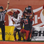 
              Utah wide receiver Devaughn Vele (17) celebrates after scoring against San Diego State safety CJ Baskerville (6) during the first half of an NCAA college football game Saturday, Sept. 17, 2022, in Salt Lake City. (AP Photo/Rick Bowmer)
            
