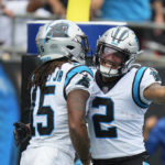 
              Carolina Panthers wide receiver Laviska Shenault Jr. (15) celebrates a 67 yard touchdown with wide receiver DJ Moore (2) during the second half of an NFL football game against the, Sunday, Sept. 25, 2022, in Charlotte, N.C. (AP Photo/Rusty Jones)
            