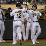 
              Oakland Athletics' Sean Murphy, left, is congratulated by Ramon Laureano, right, after hitting a three-run home run against the Atlanta Braves during the third inning of a baseball game in Oakland, Calif., Tuesday, Sept. 6, 2022. (AP Photo/Jed Jacobsohn)
            