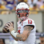 
              North Carolina State's Devin Leary (13) looks to pass the ball against East Carolina during the second half of an NCAA college football game in Greenville, N.C., Saturday, Sept. 3, 2022. (AP Photo/Karl B DeBlaker)
            