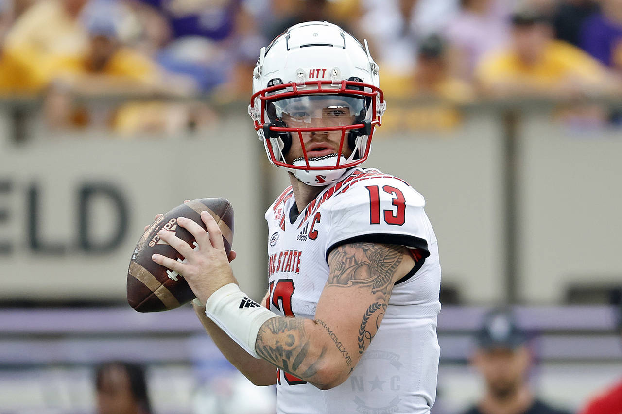 North Carolina State's Devin Leary (13) looks to pass the ball against East Carolina during the sec...