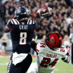 
              Texas Tech's Malik Dunlap (24) breaks up a pass intended for North Carolina State's Julian Gray (8) during the first half of an NCAA college football game in Raleigh, N.C., Saturday, Sept. 17, 2022. (AP Photo/Karl B DeBlaker)
            
