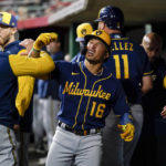 
              Milwaukee Brewers' Kolten Wong (16) celebrates with teammates in the dugout after his two-run home run during the sixth inning of the team's baseball game against the Cincinnati Reds on Thursday, Sept. 22, 2022, in Cincinnati. (AP Photo/Jeff Dean)
            