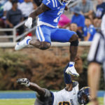 
              Duke's Jordan Waters (7) hurdles over North Carolina A&T's Janaz Sumpter (7) during the first half of an NCAA college football game in Durham, N.C., Saturday, Sept. 17, 2022. (AP Photo/Ben McKeown)
            