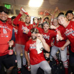 
              Members of the St. Louis Cardinals celebrate after defeating the Milwaukee Brewers in a baseball game to win the National League Central title Tuesday, Sept. 27, 2022, in Milwaukee. (AP Photo/Morry Gash)
            