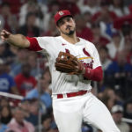 
              St. Louis Cardinals third baseman Nolan Arenado throws out Chicago Cubs' Nick Madrigal at first during the fifth inning of a baseball game Friday, Sept. 2, 2022, in St. Louis. (AP Photo/Jeff Roberson)
            