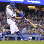 
              Los Angeles Dodgers' Chris Taylor hits a three-run home run during the fourth inning of a baseball game against the Arizona Diamondbacks Monday, Sept. 19, 2022, in Los Angeles. (AP Photo/Mark J. Terrill)
            