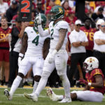
              Baylor linebacker Matt Jones (2) celebrates after tackling Iowa State running back Jirehl Brock (21) during the second half of an NCAA college football game, Saturday, Sept. 24, 2022, in Ames, Iowa. Baylor won 31-24. (AP Photo/Charlie Neibergall)
            