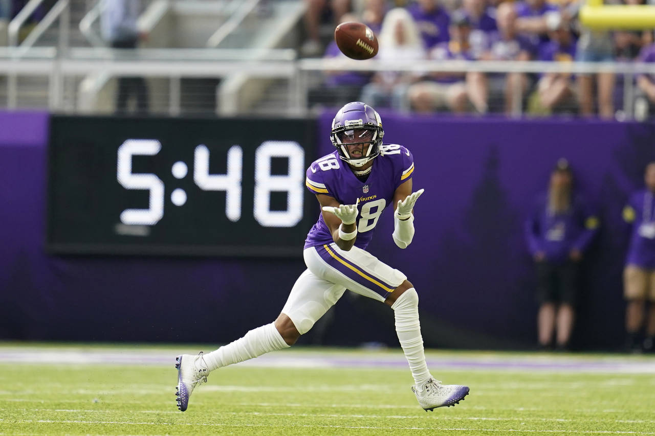 Minnesota Vikings wide receiver Justin Jefferson (18) catches a pass during the first half of an NF...