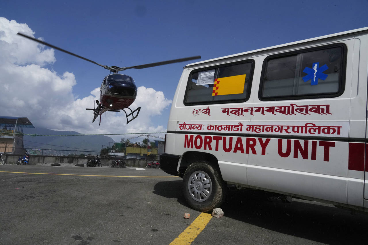 A helicopter carrying the body of famed U.S. extreme skier, Hilaree Nelson, lands at a hospital in ...