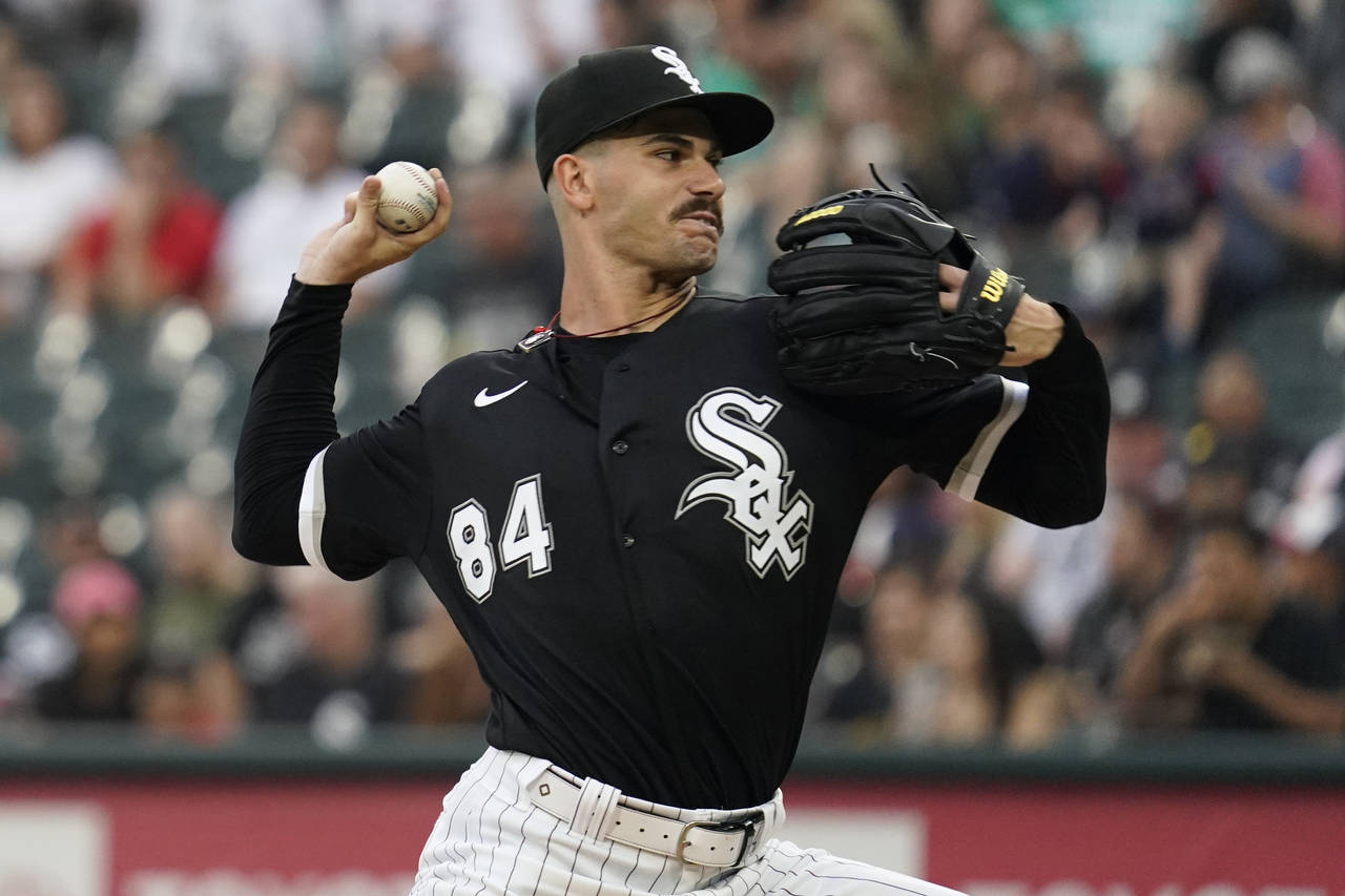 Chicago White Sox starting pitcher Dylan Cease throws against the Minnesota Twins during the first ...