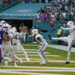 
              Miami Dolphins punter Thomas Morstead (4) sees the ball go backwards after attempting a punt during the second half of an NFL football game against the Buffalo Bills, Sunday, Sept. 25, 2022, in Miami Gardens, Fla. The play resulted in a safety for the Buffalo Bills. (AP Photo/Rebecca Blackwell)
            