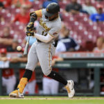 
              Pittsburgh Pirates' Rodolfo Castro hits an RBI-single during the ninth inning of a baseball game against the Cincinnati Reds in Cincinnati, Wednesday, Sept. 14, 2022. The Pirates won 10-4. (AP Photo/Aaron Doster)
            