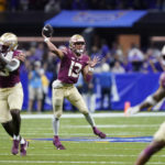 
              Florida State quarterback Jordan Travis (13) passes in the second half of an NCAA college football game against LSU in New Orleans, Sunday, Sept. 4, 2022. Florida State won 24-23. (AP Photo/Gerald Herbert)
            