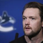 
              Vancouver Canucks goalie Thatcher Demko responds to questions during a news conference ahead of the NHL hockey team's training camp,  Wednesday, Sept. 21, 2022, in in Vancouver, British Columbia. (Darryl Dyck/The Canadian Press via AP)
            