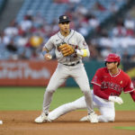
              Los Angeles Angels designated hitter Shohei Ohtani (17) is out at second after a throw to Houston Astros shortstop Jeremy Pena (3) during the first inning of a baseball game in Anaheim, Calif., Friday, Sept. 2, 2022. (AP Photo/Ashley Landis)
            