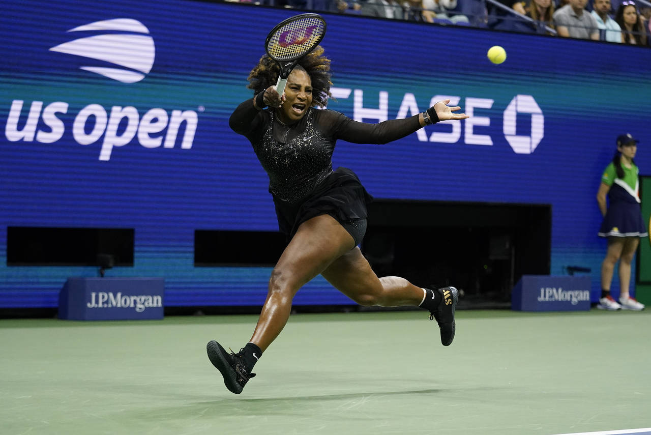 FILE - Serena Williams, of the United States, returns a shot to Ajla Tomljanovic, of Australia, dur...