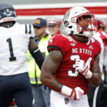 
              North Carolina State's Delbert Mimms III (34) celebrates his touchdown during the first half of an NCAA college football game against the Charleston Southern in Raleigh, N.C., Saturday, Sept. 10, 2022. (AP Photo/Karl B DeBlaker)
            
