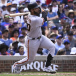 
              San Francisco Giants' David Villar hits an RBI double against the Chicago Cubs during the second inning of a baseball game, in Chicago, Saturday, Sept.10, 2022. (AP Photo/Matt Marton)
            