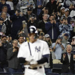 
              Fans watch as New York Yankees' Aaron Judge comes to bat during the third inning of the team's baseball game against the Baltimore Orioles on Friday, Sept. 30, 2022, in New York. (AP Photo/Adam Hunger)
            