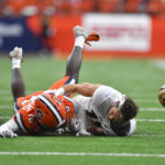 
              Purdue wide receiver Charlie Jones, right, loses his helmet and the ball while diving for a pass defended by Syracuse defensive back Garrett Williams during the first half of an NCAA college football game in Syracuse, N.Y., Saturday, Sept. 17, 2022. (AP Photo/Adrian Kraus)
            