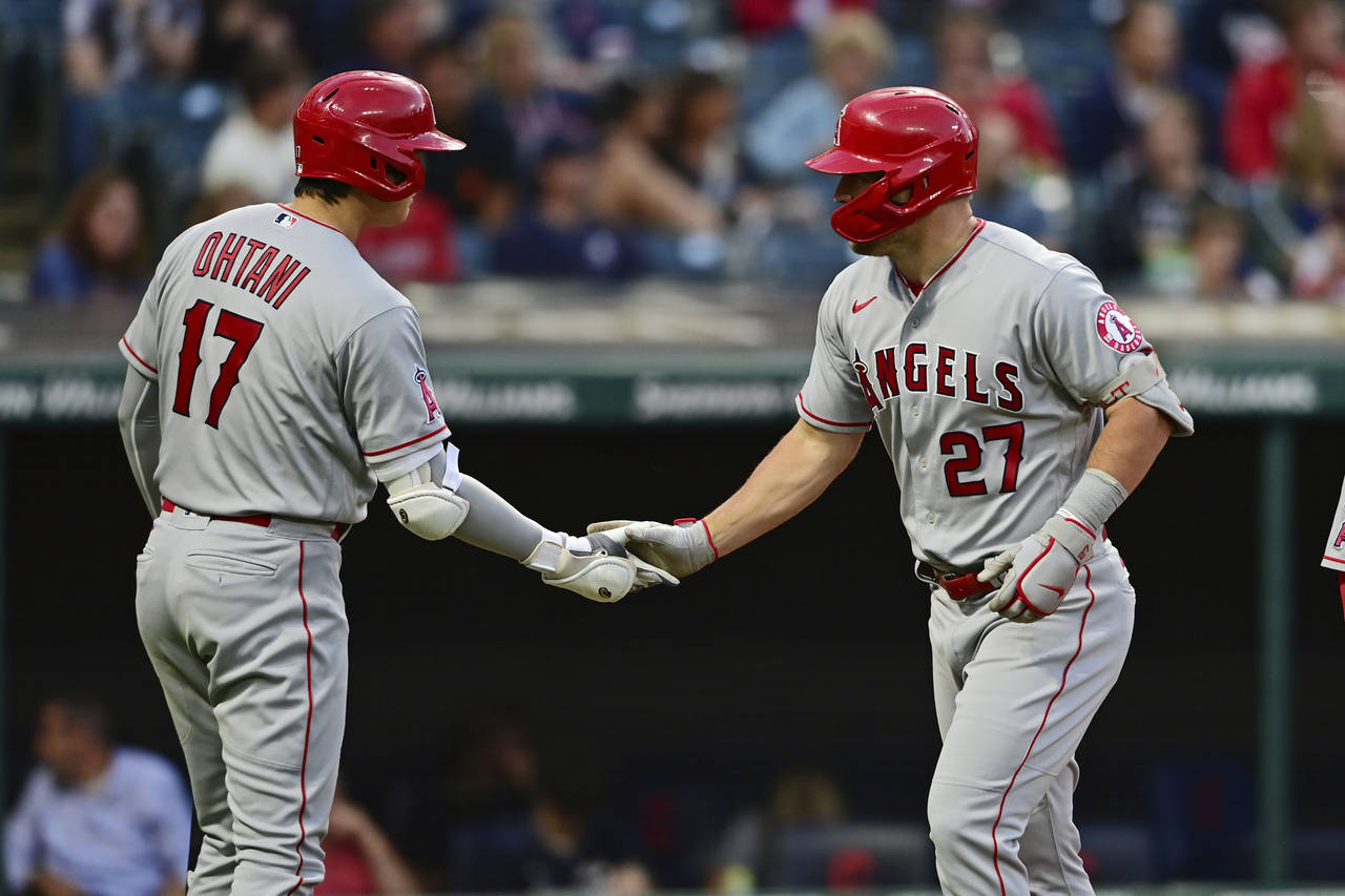 Los Angeles Angels' Mike Trout, right, is congratulated by Shohei Ohtani after hitting a two-run ho...