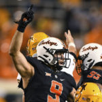 
              Oklahoma State defensive end Brock Martin (9) gestures following a stop against Indiana State during the second half of an NCAA college football game Saturday, Sept. 10, 2022, in Stillwater, Okla. (AP Photo/Brody Schmidt)
            
