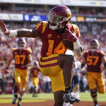 
              Southern California running back Raleek Brown (14) celebrates after scoring a touchdown during the first half of an NCAA college football game against Rice in Los Angeles, Saturday, Sept. 3, 2022. (AP Photo/Ashley Landis)
            