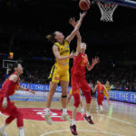 
              Australia's Steph Talbot lays up for a shot at goal as China's Han Xu looks to block during their semifinal game at the women's Basketball World Cup in Sydney, Australia, Friday, Sept. 30, 2022. (AP Photo/Mark Baker)
            