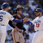 
              Los Angeles Dodgers' Max Muncy (13) is greeted at home plate by Trea Turner (6) after Muncy's three-run home run against the San Francisco Giants during the eighth inning of a baseball game Wednesday, Sept. 7, 2022, in Los Angeles. (AP Photo/Marcio Jose Sanchez)
            