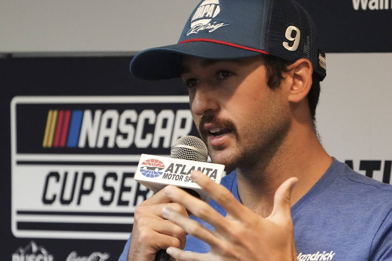 FILE - Driver Chase Elliott speaks to the media during a weather delay before qualifying the NASCAR...
