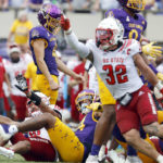
              East Carolina's Owen Daffer (41), top left, react after missing a 41-yard field goal against North Carolina State during the second half of an NCAA college football game in Greenville, N.C., Saturday, Sept. 3, 2022. (AP Photo/Karl B DeBlaker)
            