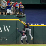 
              Cleveland Guardians left fielder Will Brennan (63) looks on as center fielder Myles Straw attempts to reach a solo home run ball hit by Texas Rangers' Marcus Semien in the third inning of a baseball game in Arlington, Texas, Saturday, Sept. 24, 2022. (AP Photo/Tony Gutierrez)
            