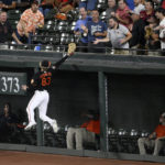 
              Baltimore Orioles right fielder Kyle Stowers (83) leaps in vain for a ball that went for a two-run home run by Boston Red Sox's Xander Bogaerts during the third inning of a baseball game, Friday, Sept. 9, 2022, in Baltimore. (AP Photo/Nick Wass)
            