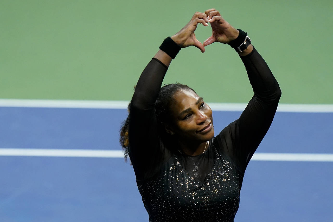 Serena Williams, of the United States, motions a heart to fans after losing to Ajla Tomljanovic, of...