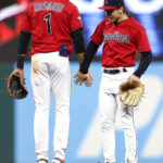 
              Cleveland Guardians shortstop Amed Rosario (1) and left fielder Steven Kwan celebrate the team's 2-1 win against the Tampa Bay Rays in a baseball game Thursday, Sept. 29, 2022, in Cleveland. (AP Photo/Ron Schwane)
            