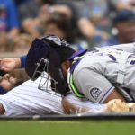 
              Chicago Cubs' Alfonso Rivas, left, is tagged out at home plate by Colorado Rockies catcher Elias Diaz, right, during the fifth inning of a baseball game, Saturday, Sept. 17, 2022, in Chicago. (AP Photo/Paul Beaty)
            