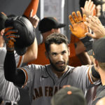 
              San Francisco Giants' David Villar is congratulated after hitting a home run against the Los Angeles Dodgers during the fourth inning of a baseball game Monday, Sept. 5, 2022, in Los Angeles. (AP Photo/John McCoy)
            