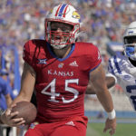 
              Kansas tight end Trevor Kardell (45) is chased by Duke defensive back Joshua Pickett (26) as he runs for a touchdown during the first half of an NCAA college football game Saturday, Sept. 24, 2022, in Lawrence, Kan. (AP Photo/Charlie Riedel)
            