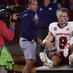 
              Fresno State quarterback Jake Haener is carted off the field after being injured while getting sacked during the second half of an NCAA college football game against Southern California Saturday, Sept. 17, 2022, in Los Angeles. (AP Photo/Mark J. Terrill)
            