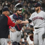
              Cleveland Guardians manager Terry Francona, left, pulls starting pitcher Aaron Civale as catcher Austin Hedges watches during the sixth inning of the team's baseball game against the Chicago White Sox on Tuesday, Sept. 20, 2022, in Chicago. (AP Photo/Charles Rex Arbogast)
            