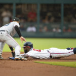 
              Miami Marlins second base Charles Leblanc, left, tags out Atlanta Braves Michael Harris II, right, who was was caught stealing second base in the sixth inning of a baseball game Sunday, Sept. 4, 2022, in Atlanta. (AP Photo/Hakim Wright Sr.)
            