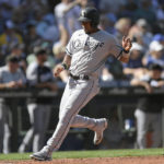 
              Chicago White Sox's Elvis Andrus scores against the Seattle Mariners during the sixth inning of a baseball game Wednesday, Sept. 7, 2022, in Seattle. (AP Photo/Caean Couto)
            