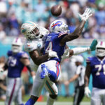 
              Miami Dolphins cornerback Xavien Howard (25) breaks up a pass intended for Buffalo Bills wide receiver Stefon Diggs (14) during the first half of an NFL football game, Sunday, Sept. 25, 2022, in Miami Gardens, Fla. (AP Photo/Wilfredo Lee )
            