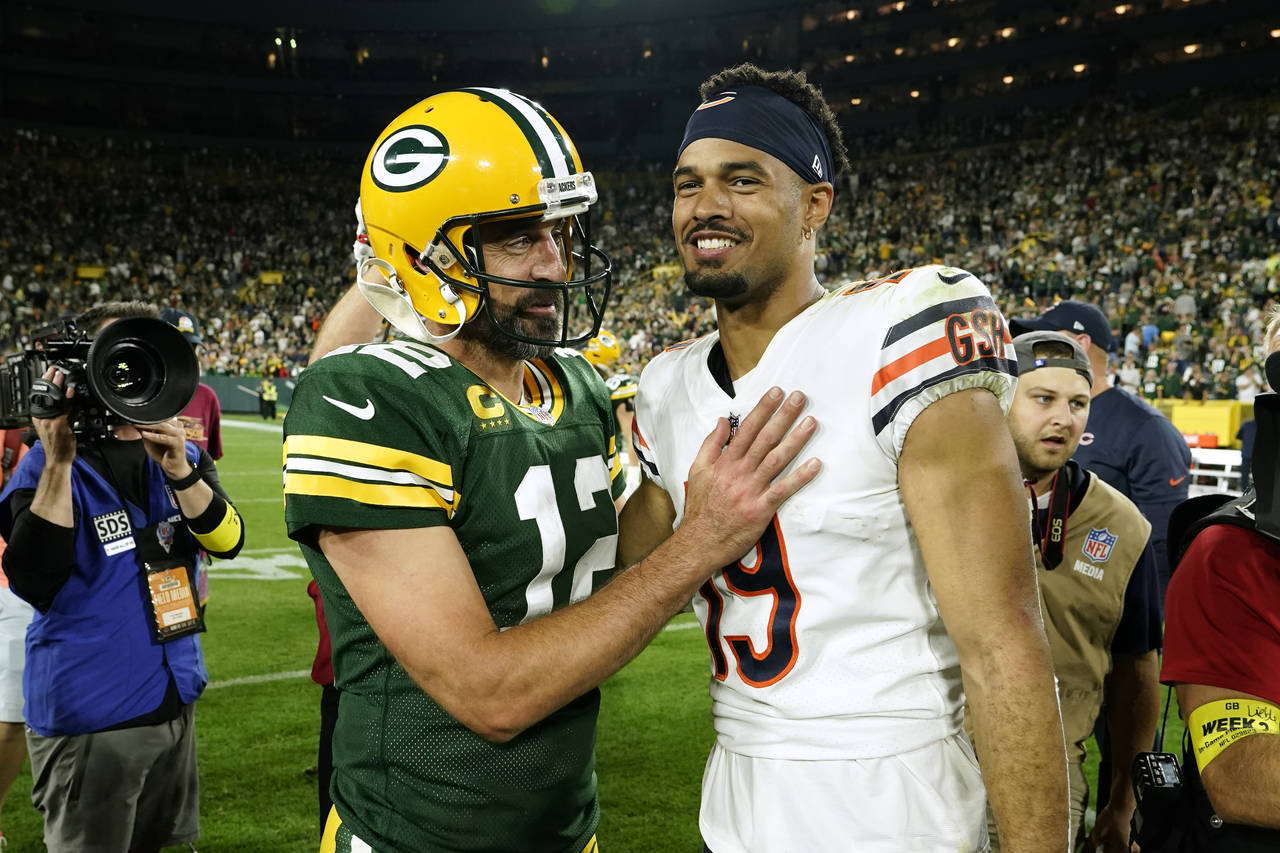 Green Bay Packers quarterback Aaron Rodgers (12) talks with Chicago Bears wide receiver Equanimeous...