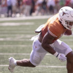 
              Texas running back Bijan Robinson (5) runs in to the end zone for a touchdown against Alabama during the first half of an NCAA college football game, Saturday, Sept. 10, 2022, in Austin, Texas. (AP Photo/Rodolfo Gonzalez)
            