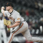 
              San Francisco Giants starting pitcher Logan Webb works against the Colorado Rockies during the first inning of a baseball game Wednesday, Sept. 21, 2022, in Denver. (AP Photo/David Zalubowski)
            