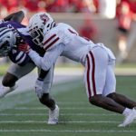 
              Kansas State wide receiver Malik Knowles (4) is tackled by South Dakota defensive back Myles Harden (1) during the first half of an NCAA college football game Saturday, Sept. 3, 2022, in Manhattan, Kan. (AP Photo/Charlie Riedel)
            