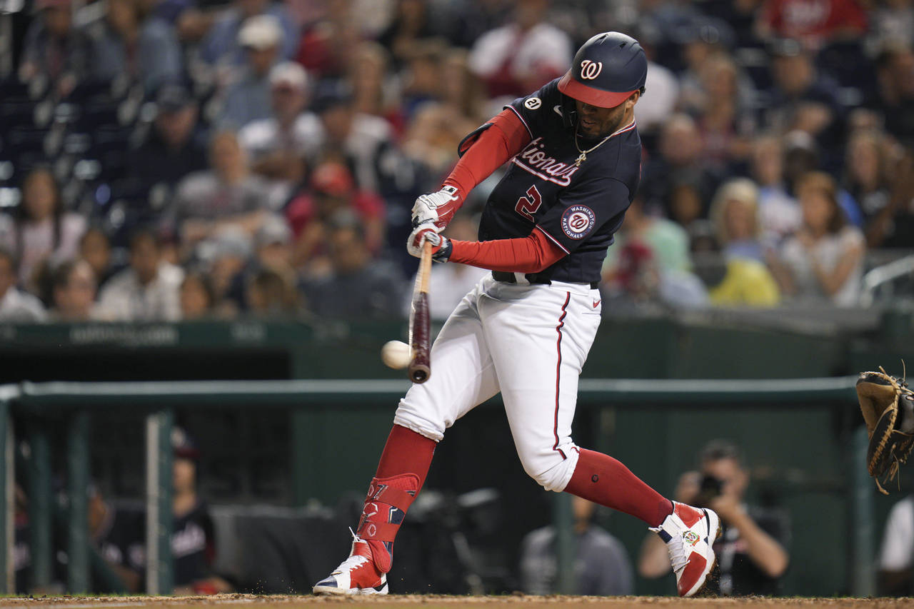 Washington Nationals' Luis Garcia hits a single against the Miami Marlins during the fifth inning o...
